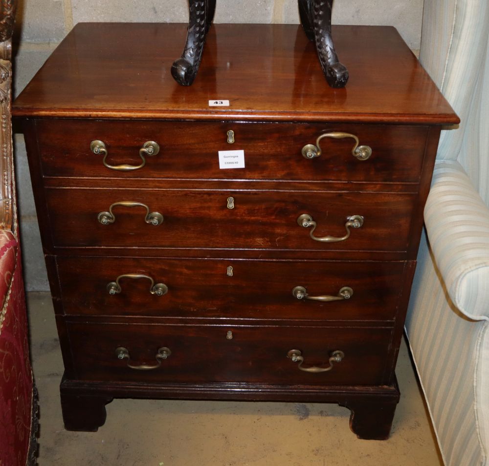 A George III mahogany commode, enclosed by a two section dummy drawer front, W.69cm